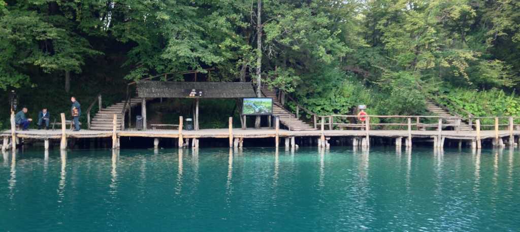 The dock to the upper lakes. Early in the morning, the workers pictured on the left walk the boardwalk with nails and a hammer to fasten loose boards.